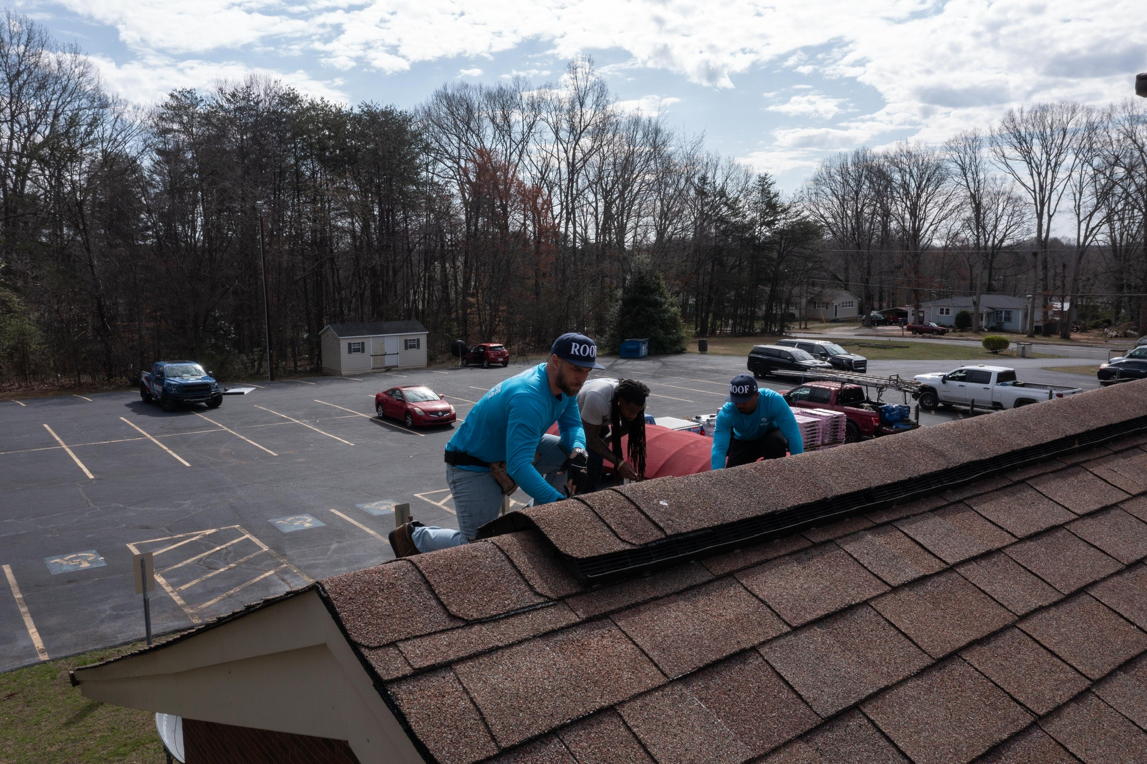 Escalade Roofing Professional Roofers Working With Parking Lot In The Back Greensboro, Nc