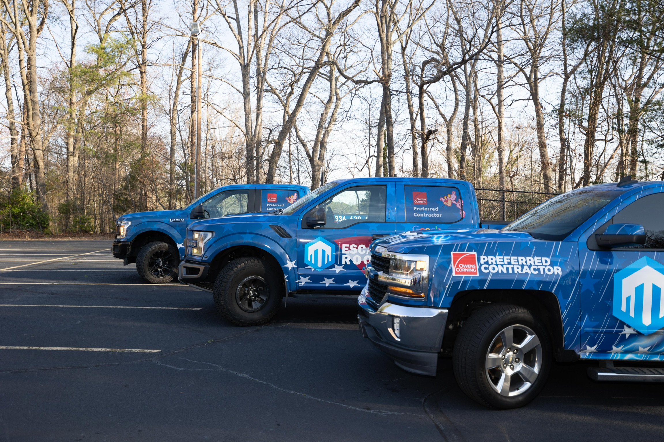 escalade roofing professional roofers trucks team picture greensboro, nc