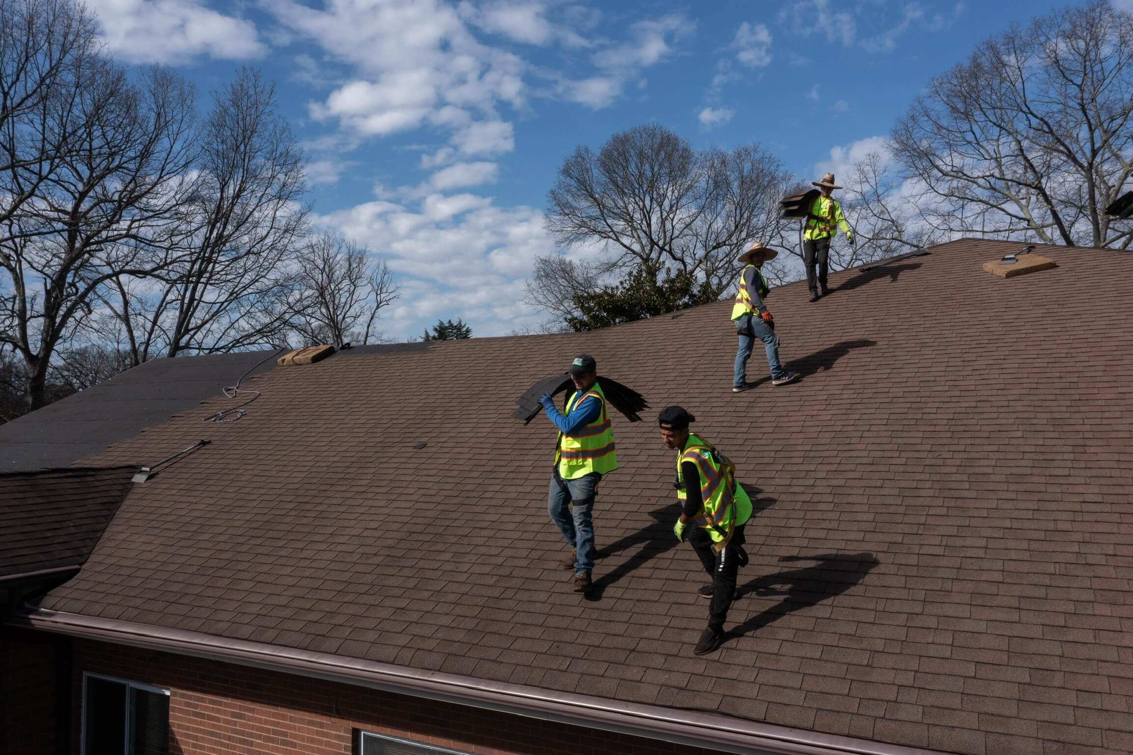 escalade roofing roofers carrying shingles high point nc
